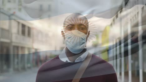 Animation-of-flag-of-argentina-waving-over-man-wearing-face-mask-during-covid-19-pandemic