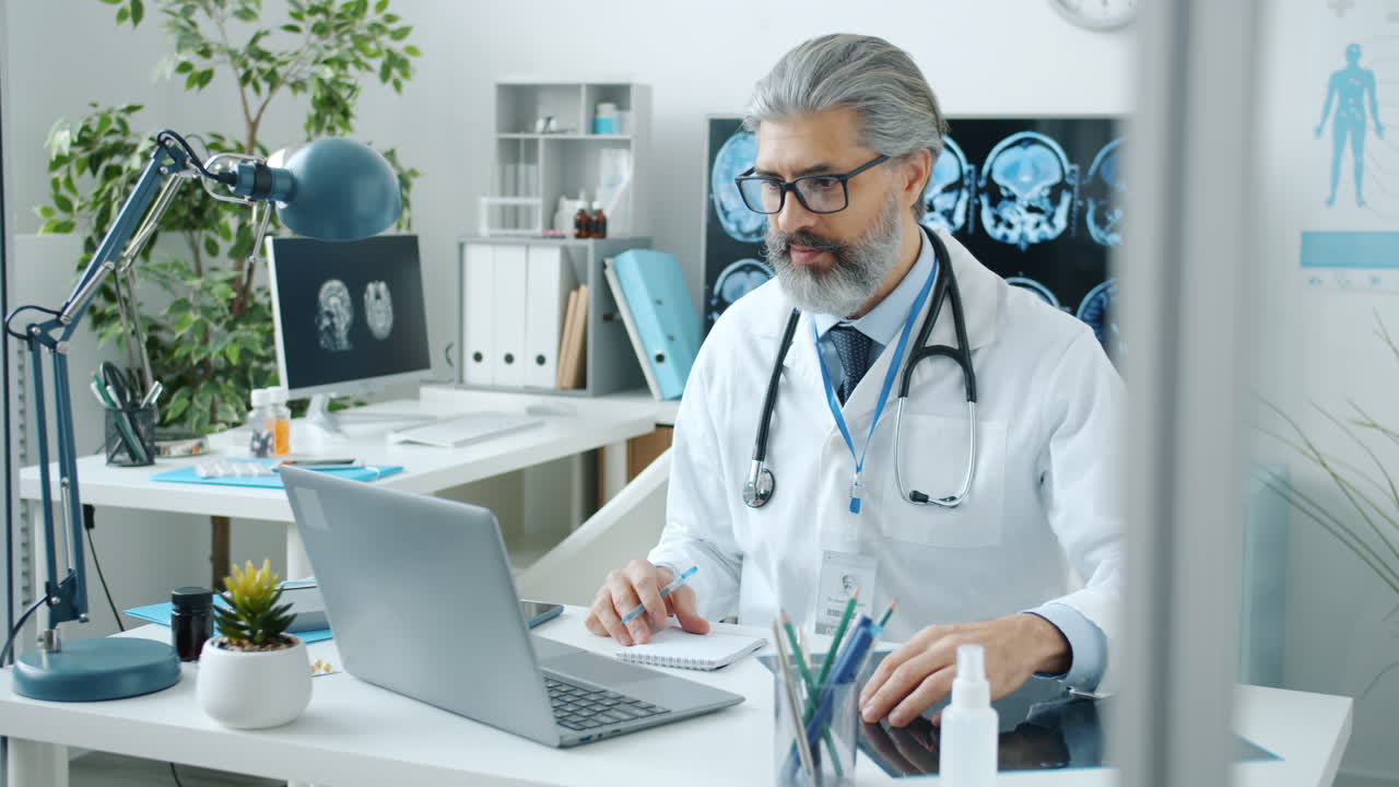 Doctor Examining X-Ray in Office