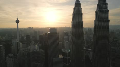 aerial view of kuala lumpur city center, skyline at sunset near petronas towers