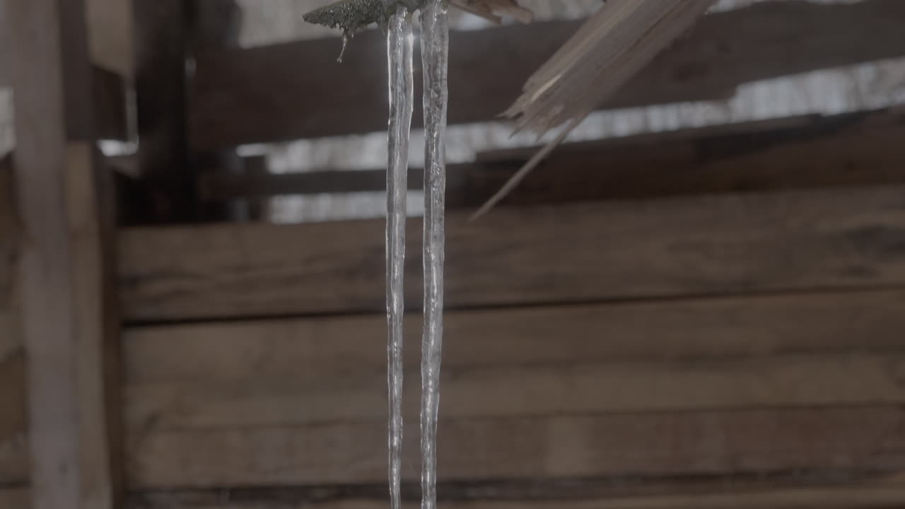 icicle slow-mo in a wooden shack