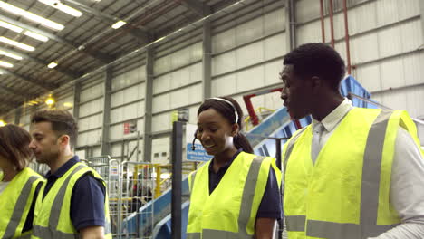 Staff-walking-through-an-industrial-building,-shot-on-R3D