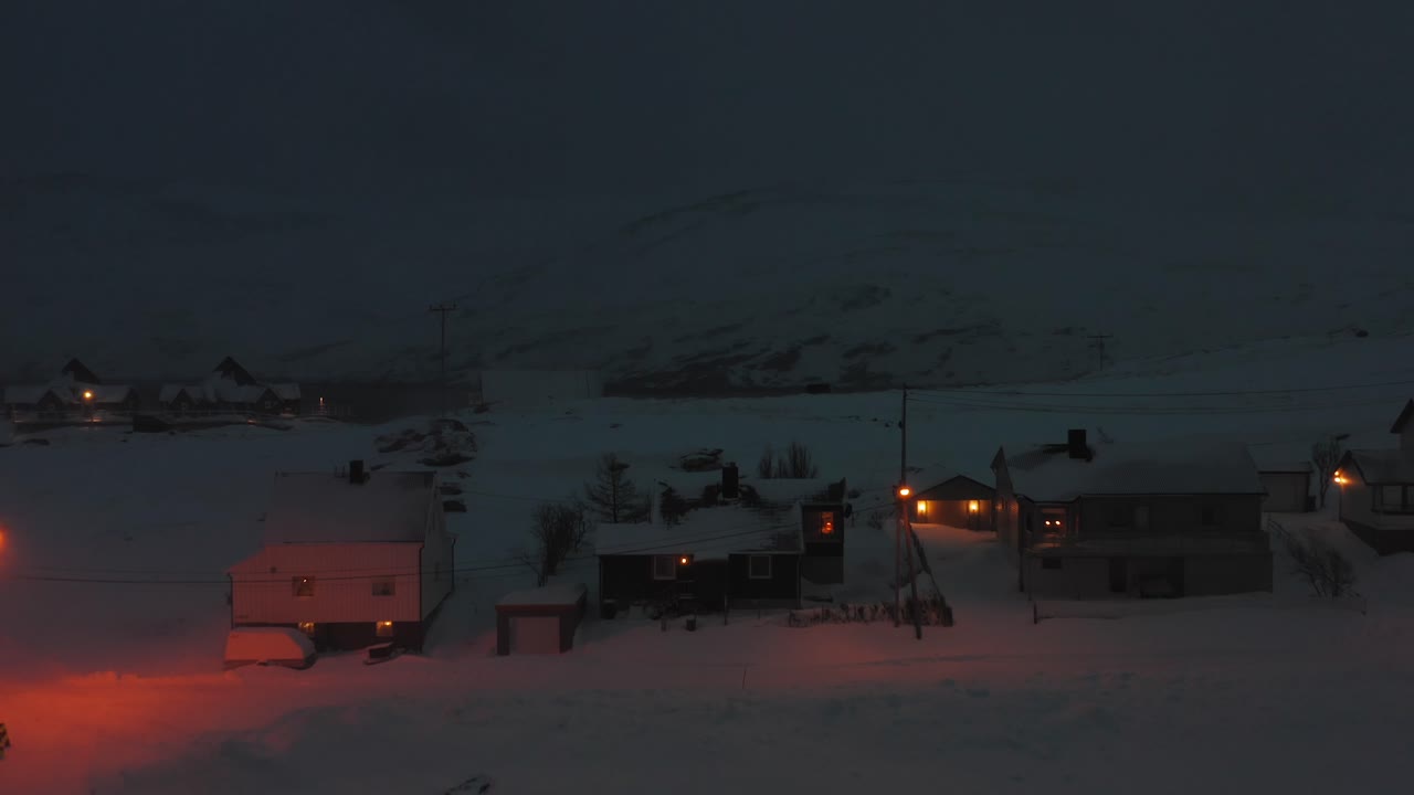 Day shot of Skarsvåg, Nordkapp just before a snow storm closes off the small fishing village. Aerial shot