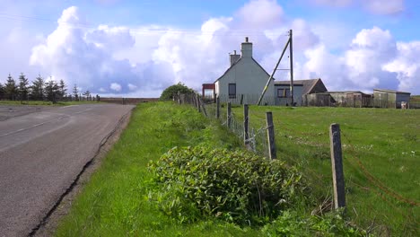 Beautiful-thunderhead-clouds-form-behind-remote-farms-near-John-O'Groats-Scotland