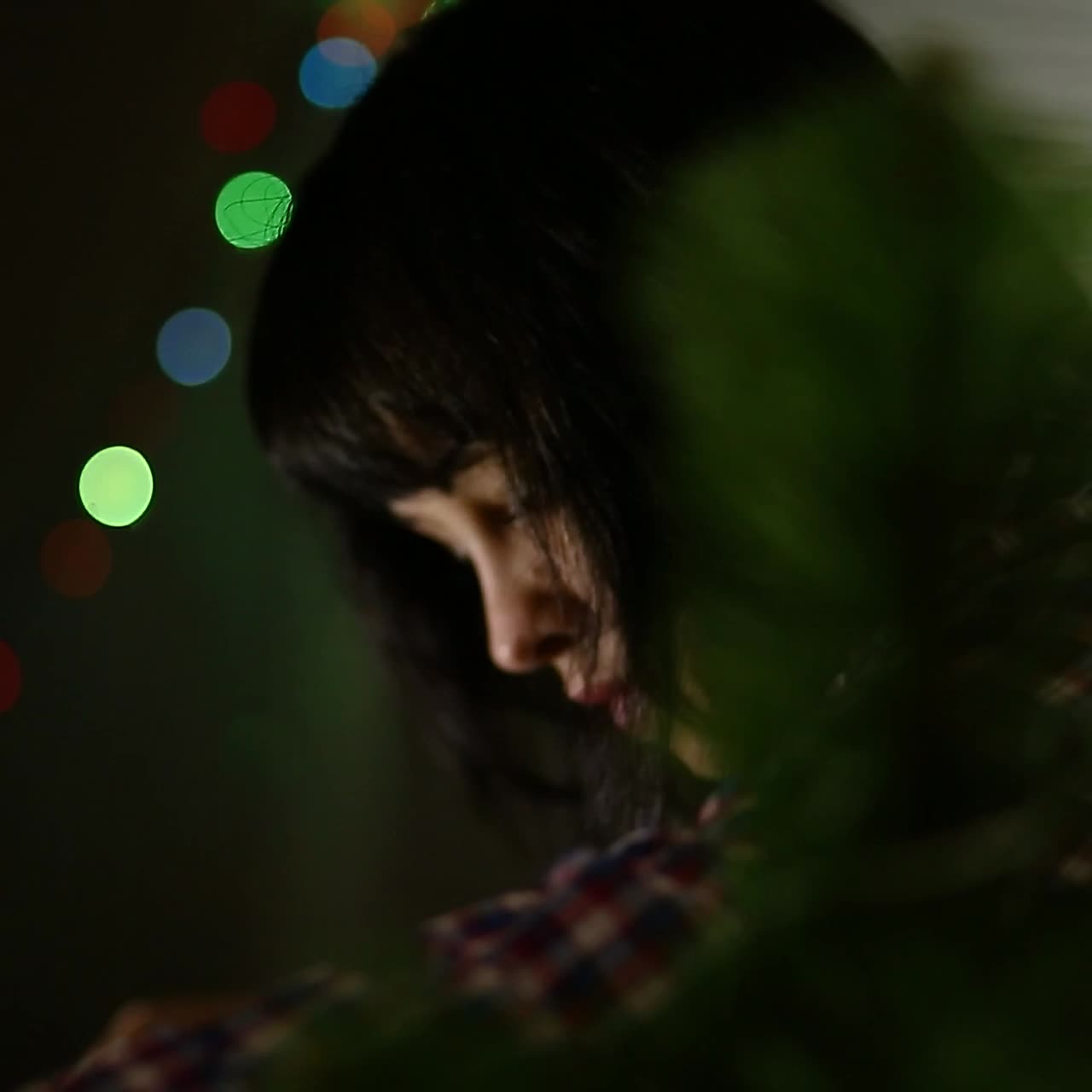 Woman Dresses Up Christmas Tree