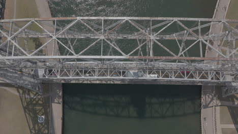 slow motion aerial shot of traffic crossing duluth's lift bridge