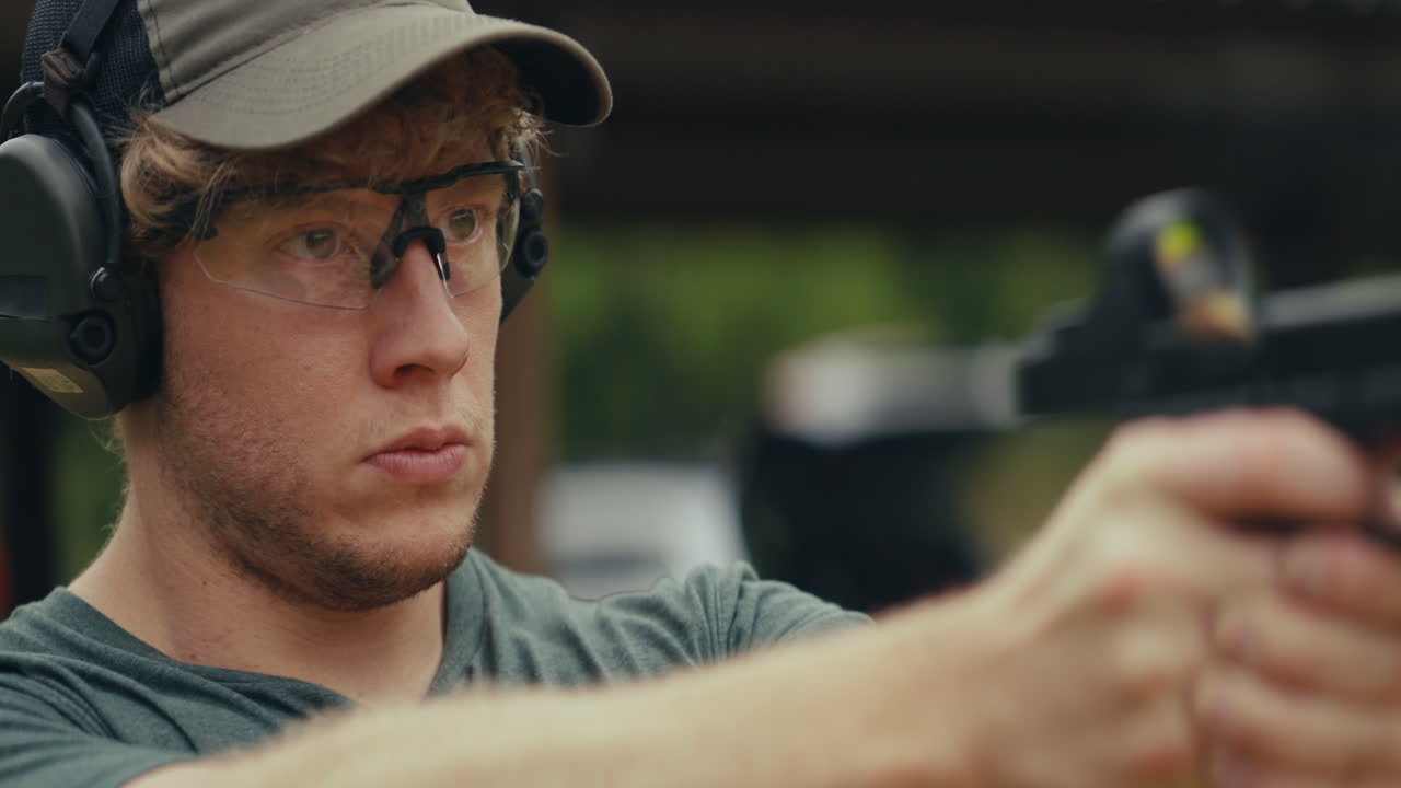 Man practicing shooting with a pistol