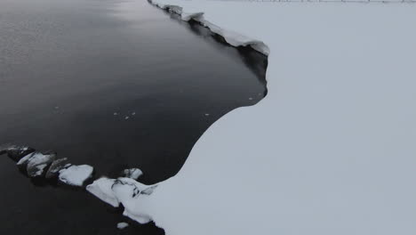 Snowy-beach-shore-from-above.-Dolly-forward