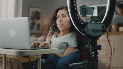 woman in wheelchair streaming online