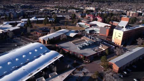 drone shot or northern arizona university campus buildings, flagstaff usa on sunny winter day