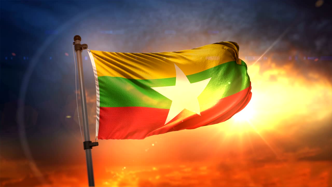 la bandera de myanmar iluminada en la hermosa salida del sol en movimiento lento 4k