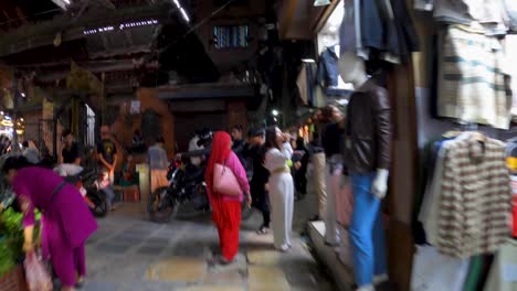 person's pov walking in the crowded street market at night in the city center of kathmandu, nepal. - hyperlapse shot