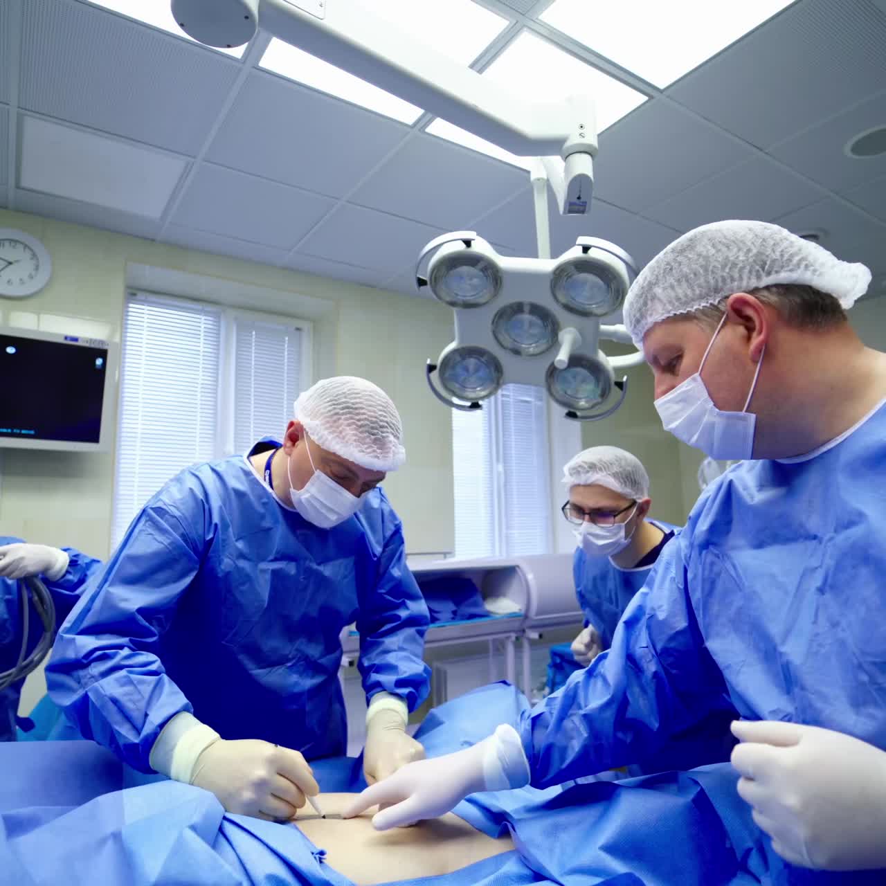 Minimally Invasive Robotic Surgery. Machine arm surgeon in futuristic operation room