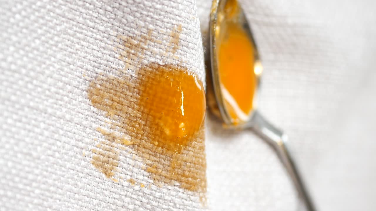Orange Liquid Stain on a Cloth with Dental Instruments