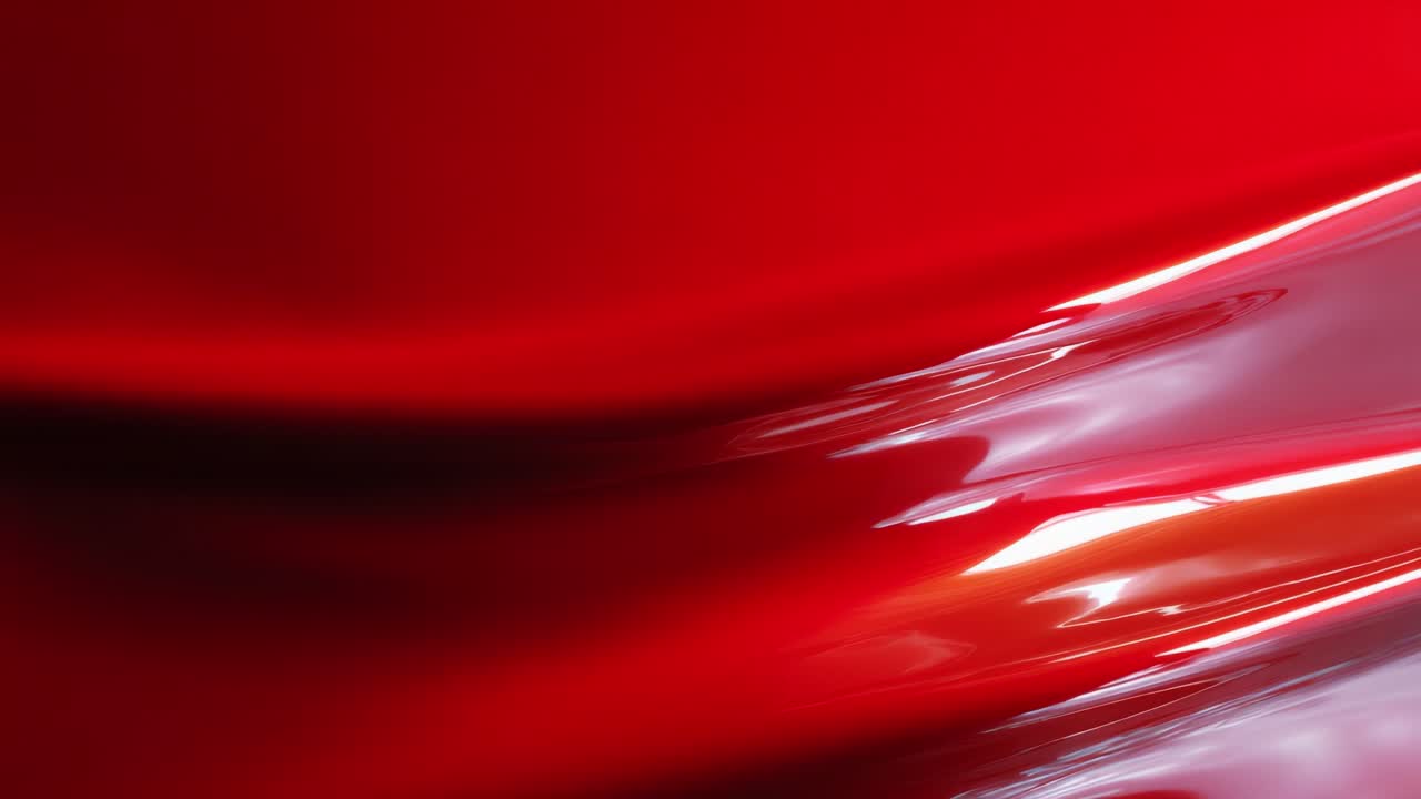 A Captivating Display of Fluid Red Tones and Curved Surfaces Capturing the Essence of Motion, Elegance, and Vibrancy Through Abstract Visuals of Color and Light Reflections