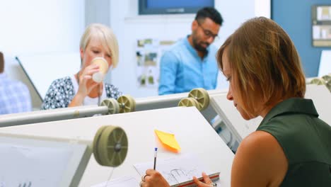 architectures working at drafting table 4k