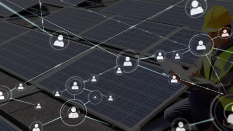 animation of network of connections over caucasian man installing solar panels