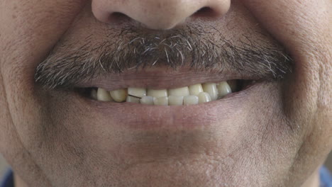 close up hispanic man mouth smiling happy teeth with moustache facial hair