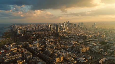 tel aviv skyline from drone. aerial shot long super wide horizon view. daytime sunset or early morning color sky coastline and office building in a modern tel aviv