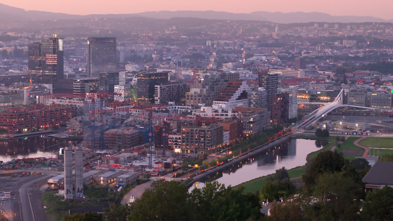 Twilight aerial riser reveal shot from Ekebergparken of Nordenga Bridge in Oslo