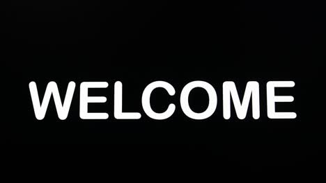 typography appearing on the screen on a black background with the word welcome