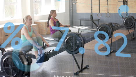 animation of interface processing data over diverse women training on rowing machines at gym