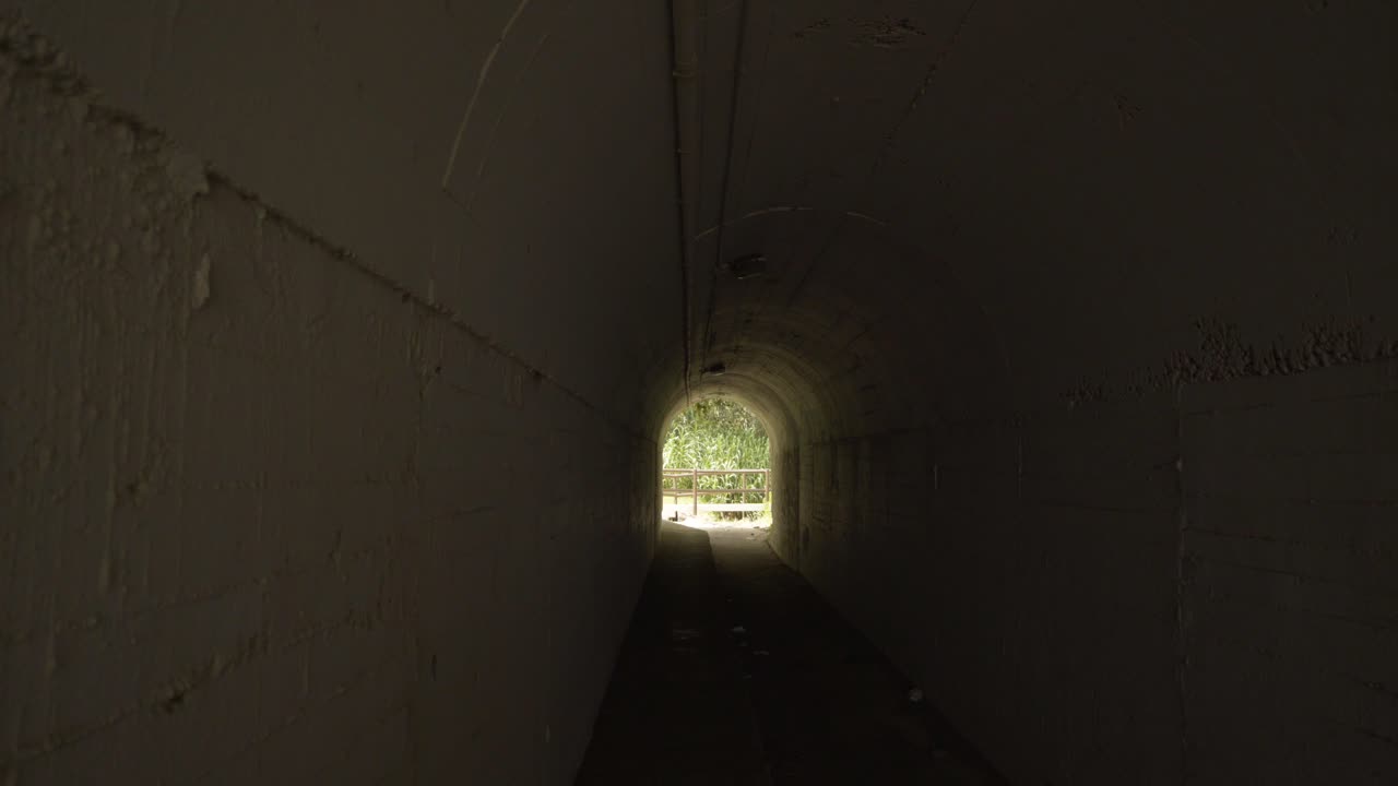 Walking down the tunnel under the beach of Cala De Mijas and out into the sunshine
