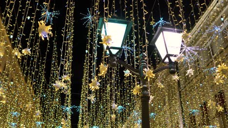 street lantern with decorative christmas garlands. new year and christmas celebration.