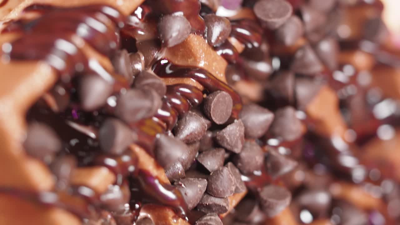 Close-up of dessert with chocolate chips and sauce