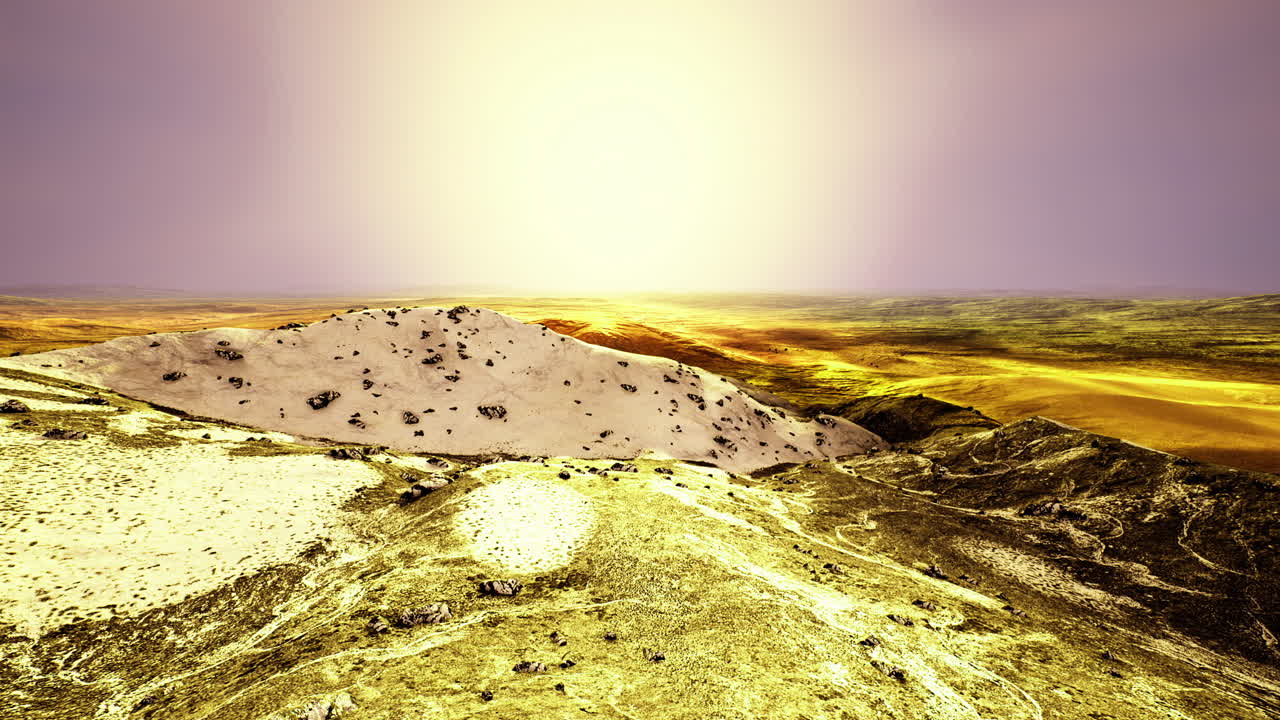 Vibrant golden landscape at sunset illuminating a serene desert expanse