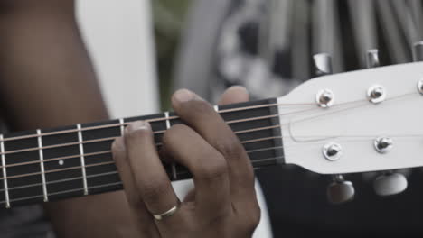 man playing guitar closeup