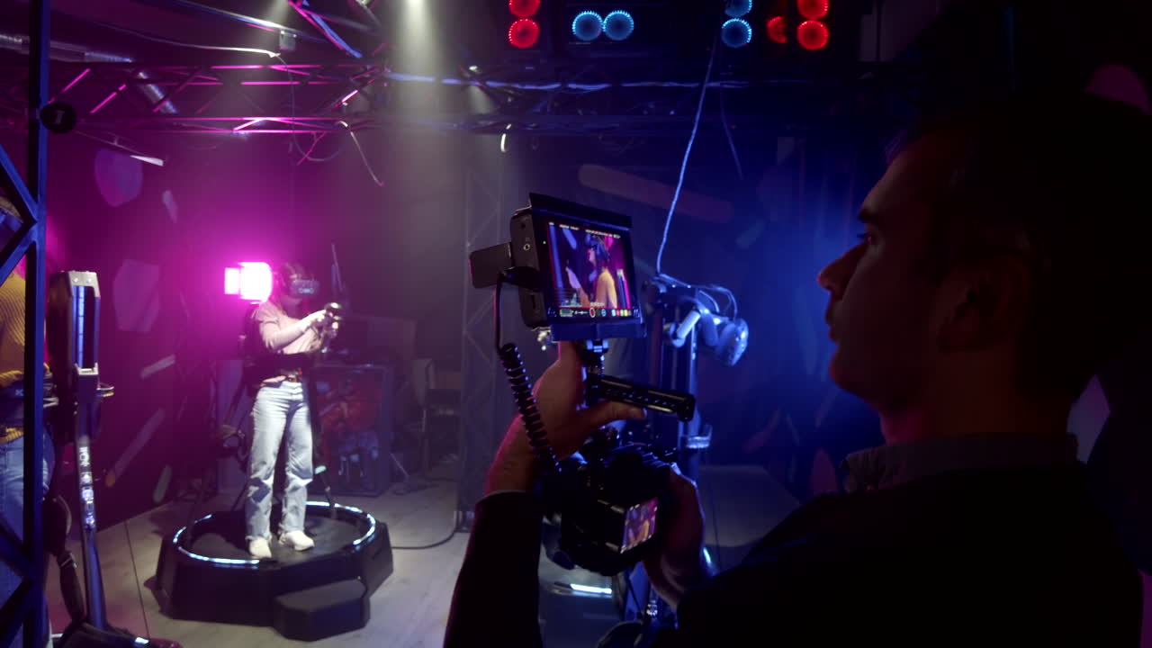 Camera filming a girl playing with a Virtual Reality headset