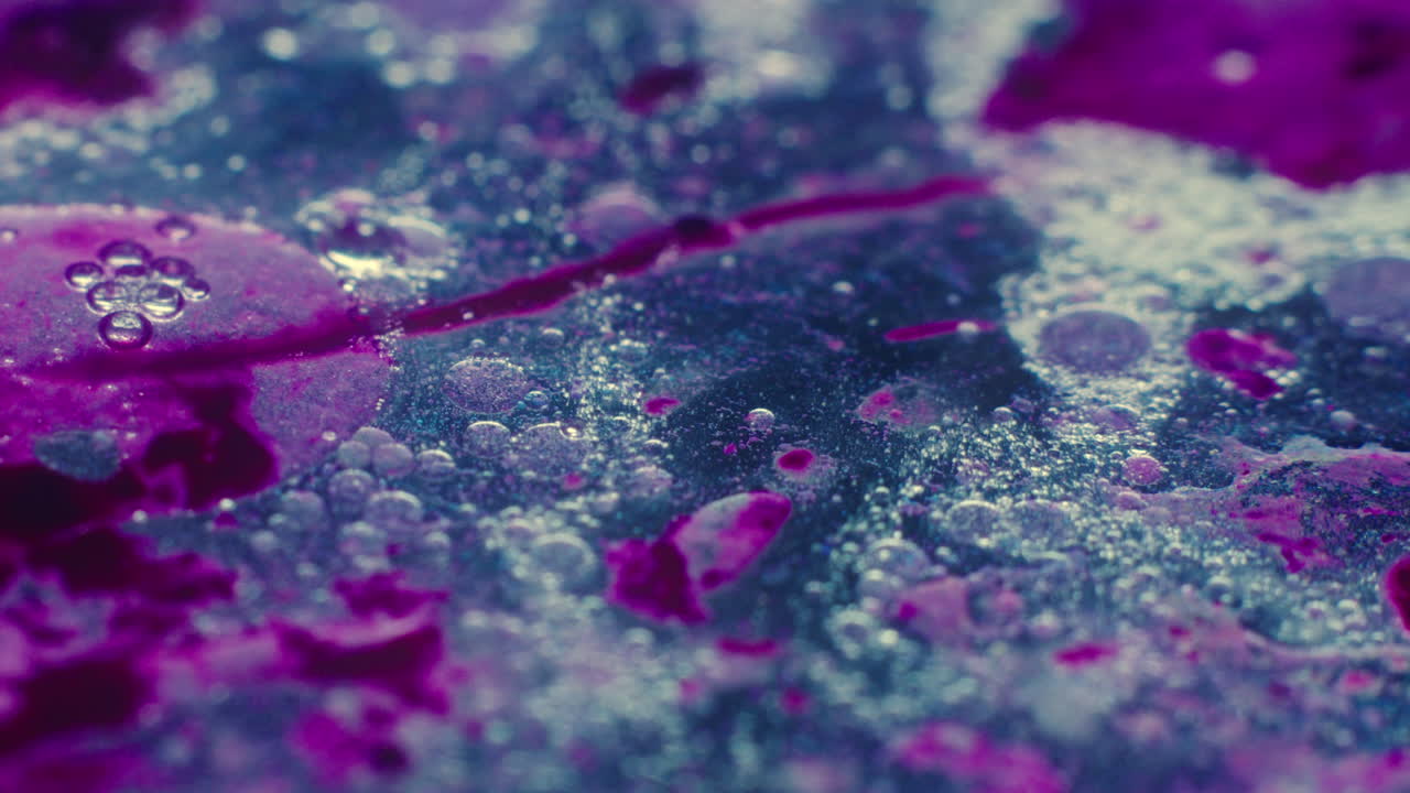 Colourful, organic, liquids macro shots buzzing and flowing