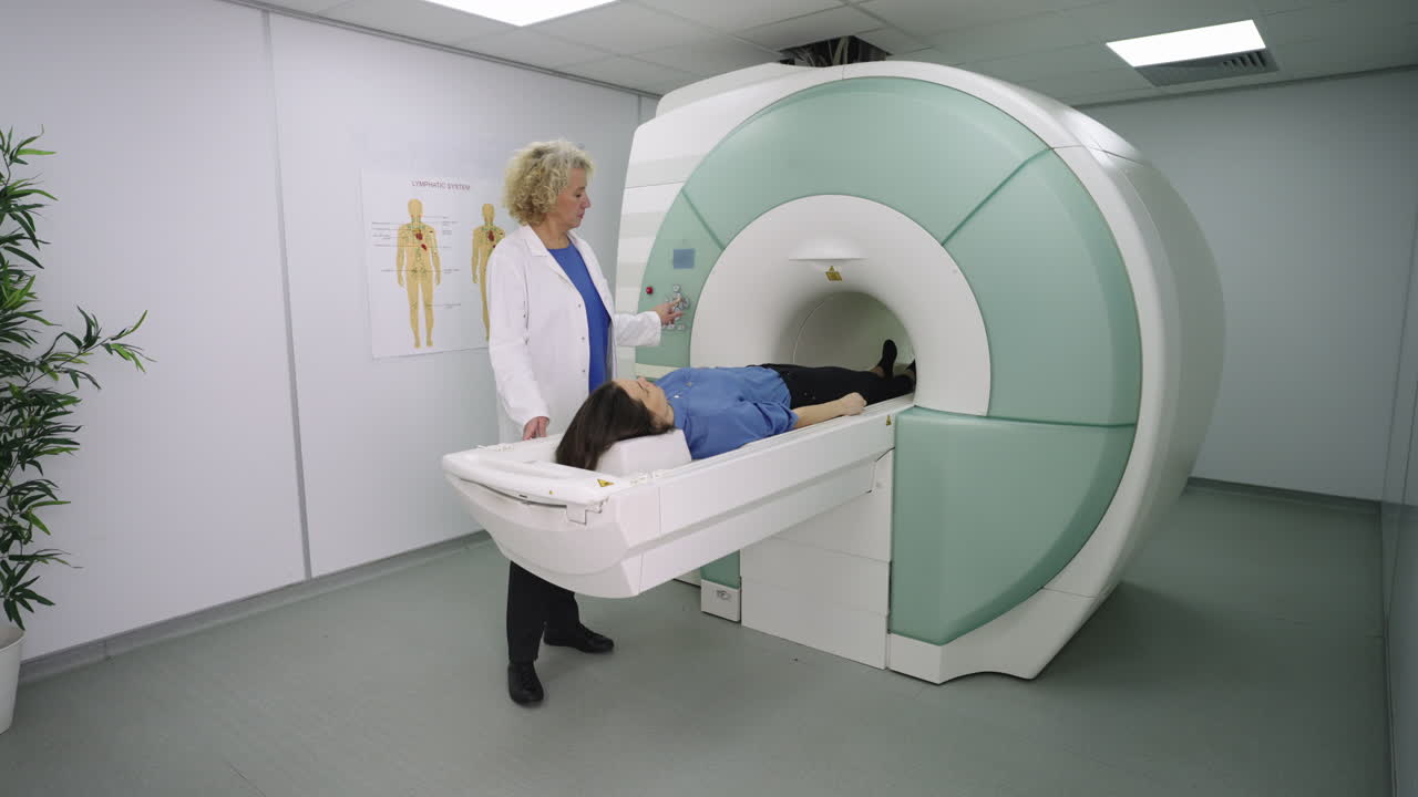 Doctor operating an MRI machine for a patient in a medical facility