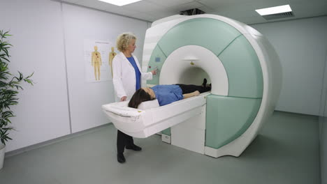 doctor operating an mri machine for a patient in a medical facility
