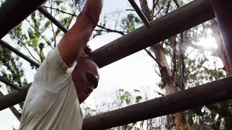 Military soldier climbing monkey bars 4k