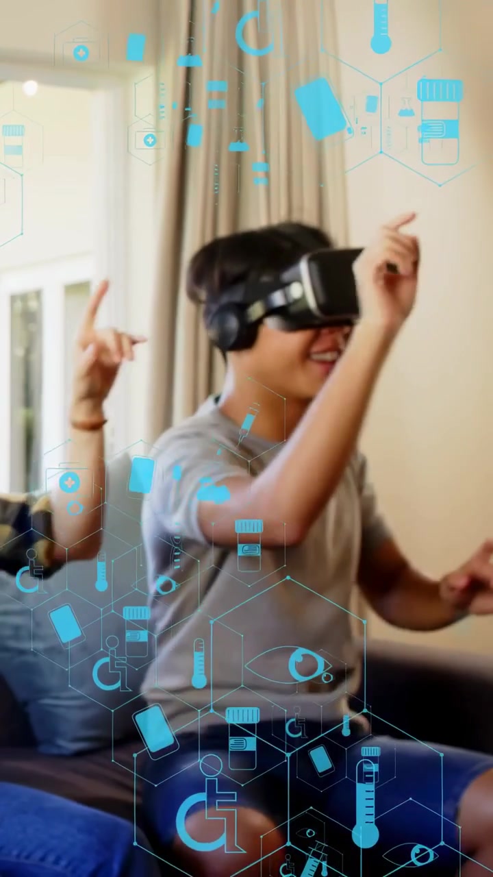 Vertical video: Man putting on VR headset, gesturing to blue hologram hex icons for shared play