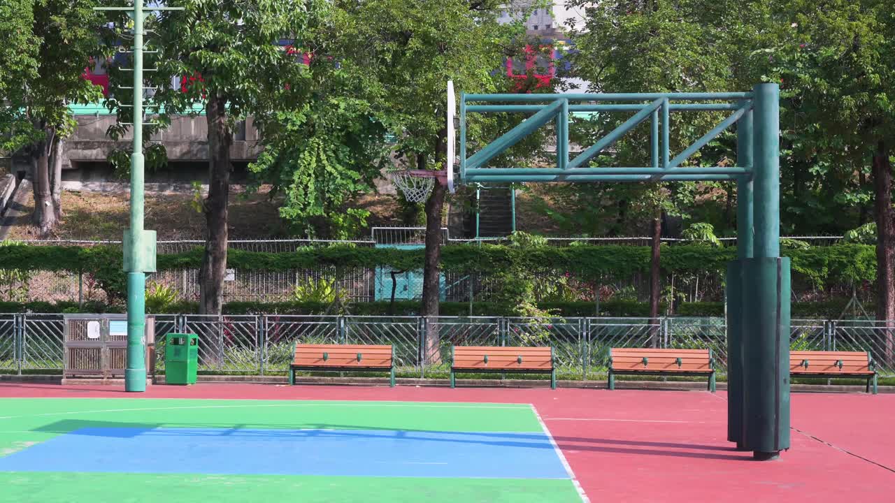 An empty colorful basketball court is seen at a playground in Hong Kong