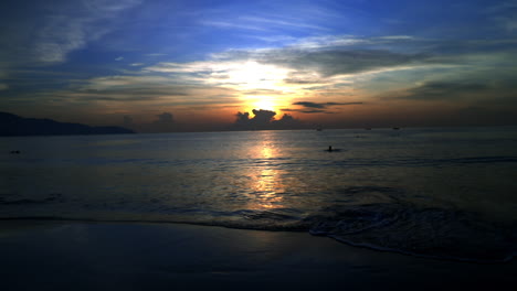 standing and looking at the sunrise in da nang in the morning