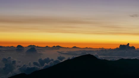 sunrise over clouds and mountains