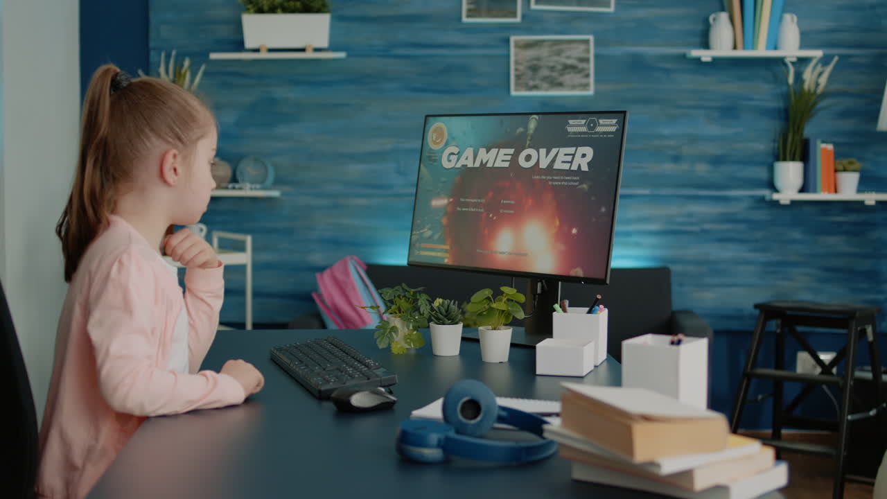 Frustrated child losing at video games on computer