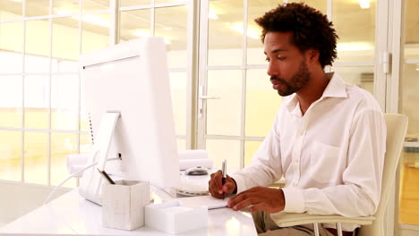 Businessman-working-at-his-desk