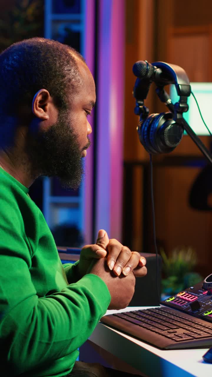 African American Music Producer Working in Home Studio