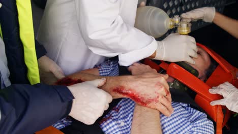 emergency medical technician holding an oxygen mask