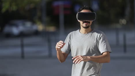 young man using vr headset on street