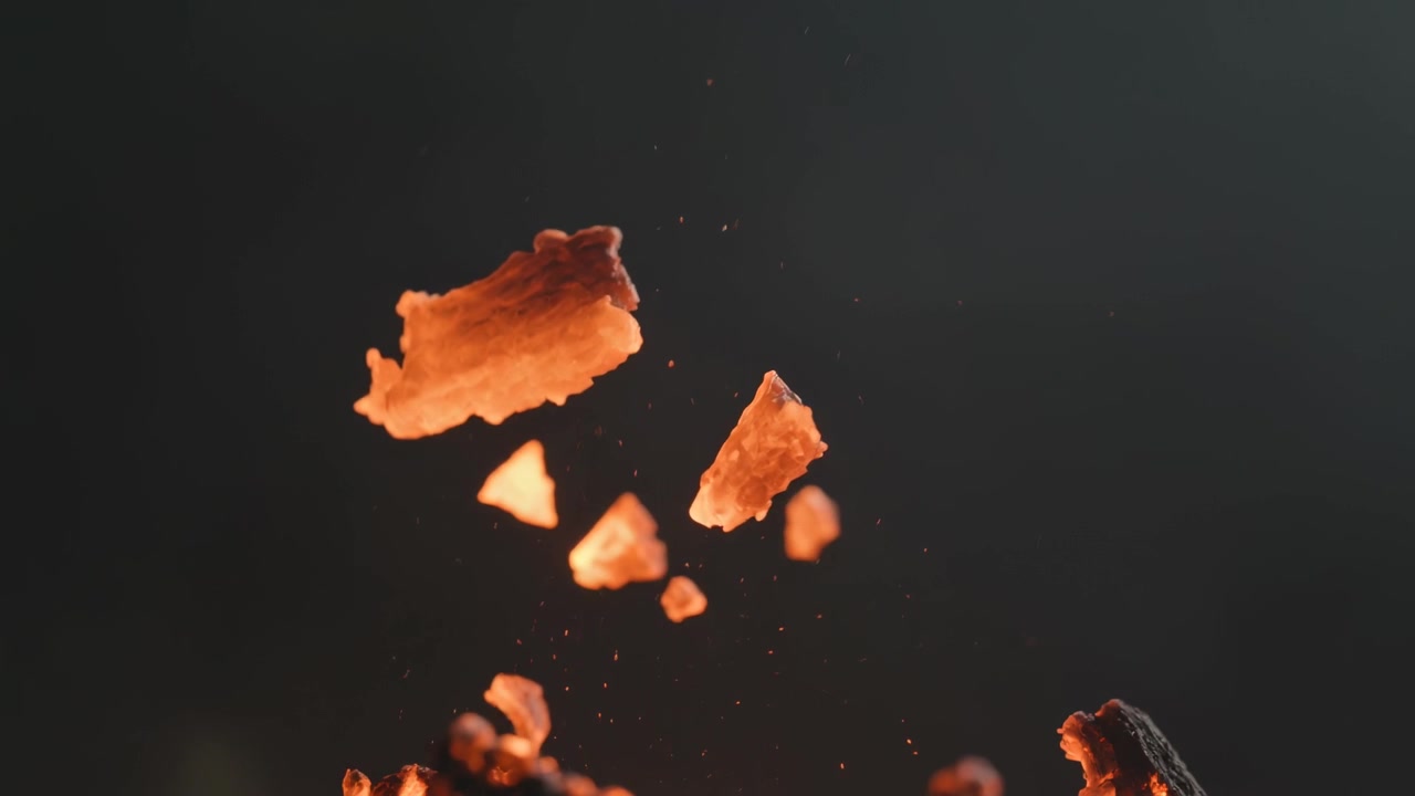 Lower-right pile releasing orange-brown flakes rising up, crumbling into crumbs in studio, warm rim