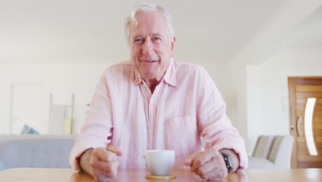 Portrait-of-happy-caucasian-senior-man-talking-and-having-video-call