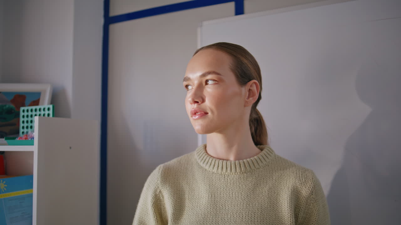 Woman teacher posing class whiteboard background portrait. Lady looking camera