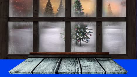 Animation-of-ho-ho-ho-text-banner-over-view-of-snow-falling-over-christmas-tree-from-window-frame