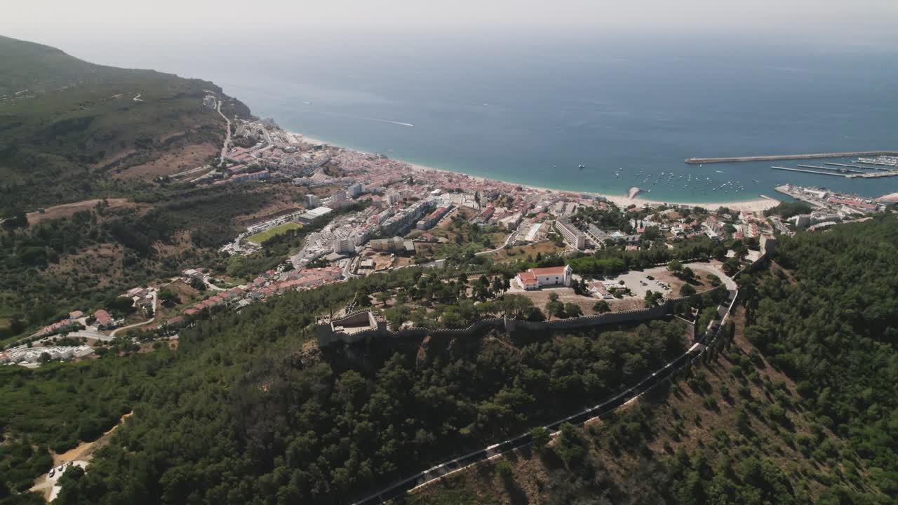 Top down view Sesimbra Natural coastline and Castle on hilltop, mesmerizing Landscape - Portugal