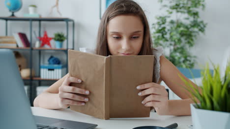teenage girl reading at home